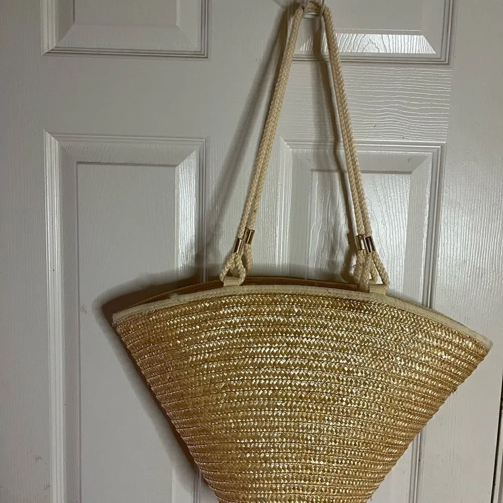 Natural straw bucket style tote bag with rope straps with gold tone acce…